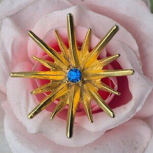 Vintage Gold Tone Starburst Brooch Pin Blue Crystal Center 1.5"